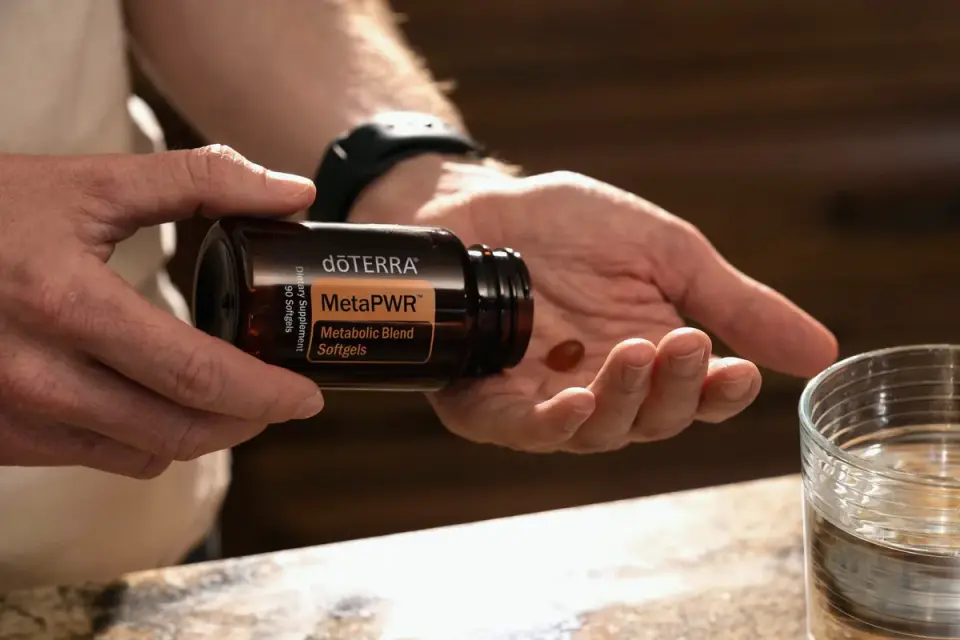 A dog owner checking the ingredient label on a supplement bottle