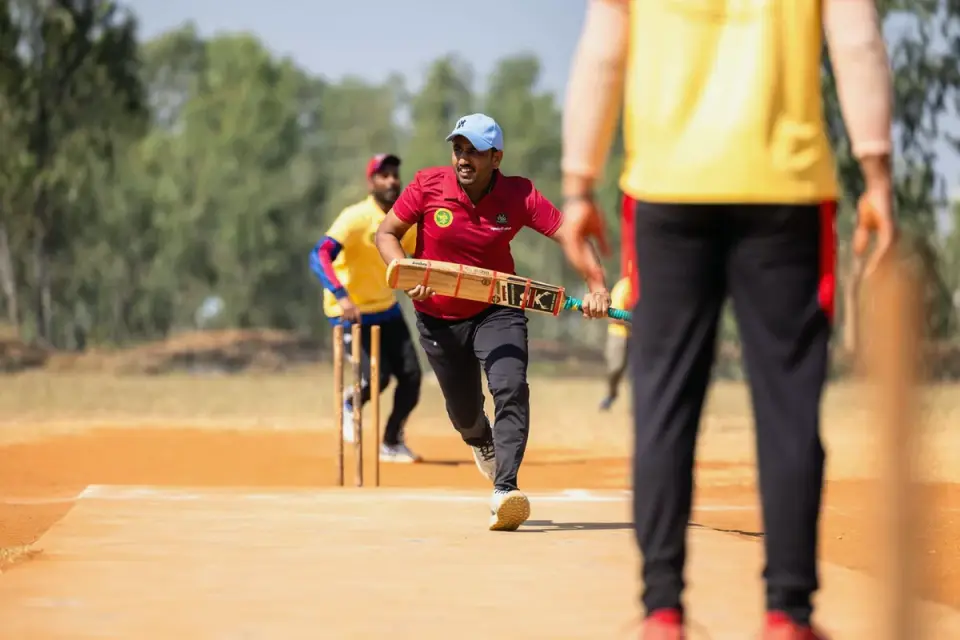A dog standing alert near a window during a storm